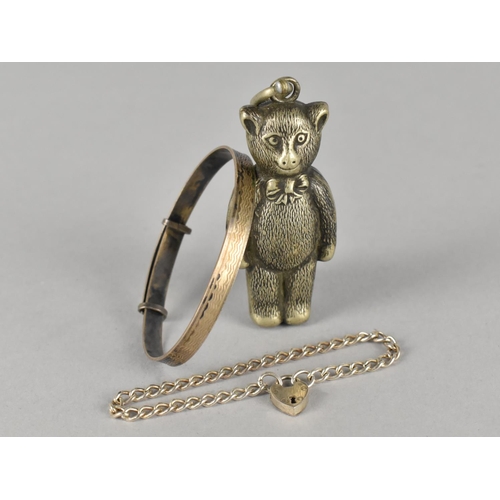 460 - Two Silver Childrens Bracelets to include a Christening Example and a White Metal Mounted Teddy Bear... 