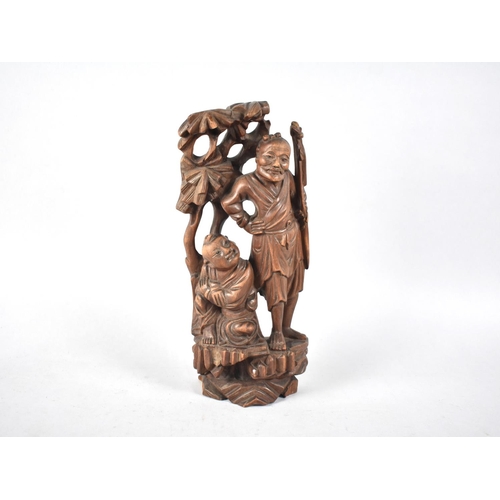 112 - A Chinese Carved Root Wood Figure Group, Immortal and Attendant under Tree, 26cms High