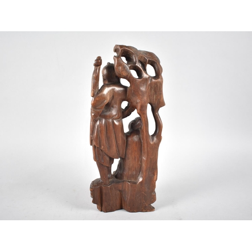 112 - A Chinese Carved Root Wood Figure Group, Immortal and Attendant under Tree, 26cms High