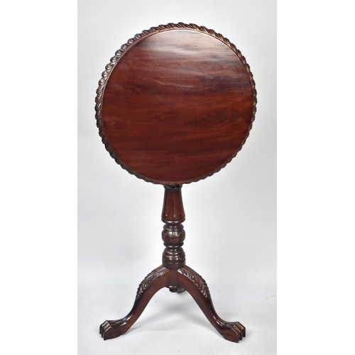 119 - A Reproduction Mahogany Snap Top Tripod Table with Claw Feet, 49cms Diameter