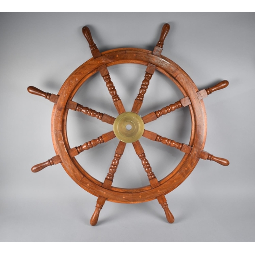 126 - A Reproduction Eight Spoke Ship's Wheel with Brass Hub, 91cms Diameter