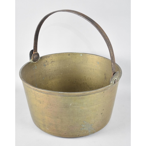 127 - A Large and Heavy Vintage Brass Jam Kettle with Iron Loop Handle, 35.5cms Diameter