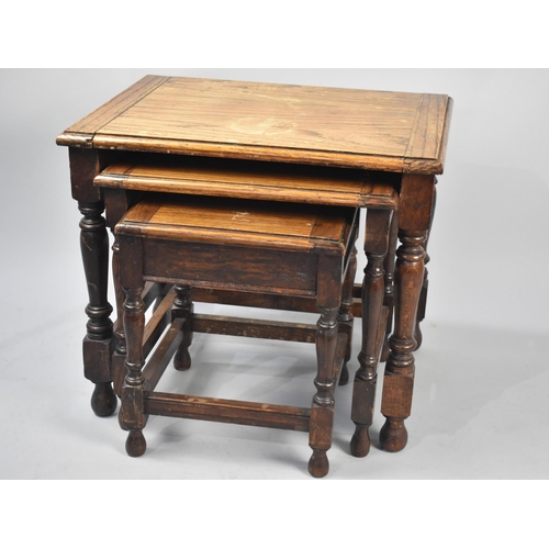 130 - A Mid 20th Century Oak Nest of Three Tables, 55cms Wide