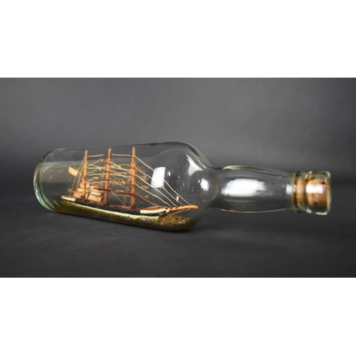 15 - An Early 20th Century Folk Art Ship in a Bottle, 19cms Long