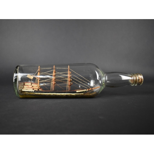 15 - An Early 20th Century Folk Art Ship in a Bottle, 19cms Long