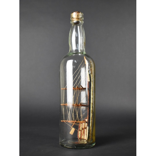 15 - An Early 20th Century Folk Art Ship in a Bottle, 19cms Long