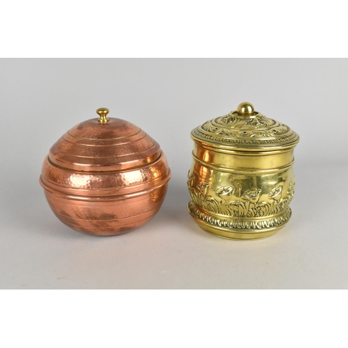 174 - A Globular Copper Lidded Tobacco Pot and a Cylindrical Brass Example, 12cms High