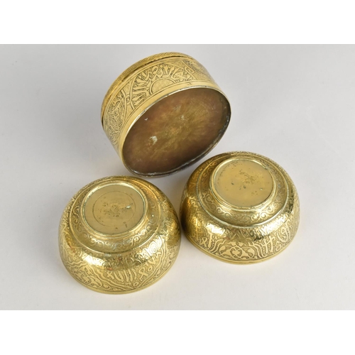 176 - A Pair of Indian Brass Bowls with Engraved Islamic Decoration, 10.5cms Diameter together with a Simi... 