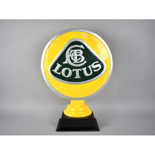 216 - A Cold Painted Metal Circular Sign for Lotus Motorcars, 38cms Diameter