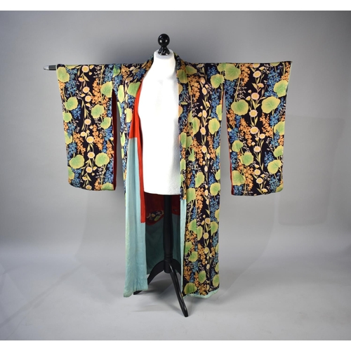 264 - An Early/Mid 20th Century Silk Kimono, Floral on Dark Blue Ground with Red Lining (Some Condition Is... 