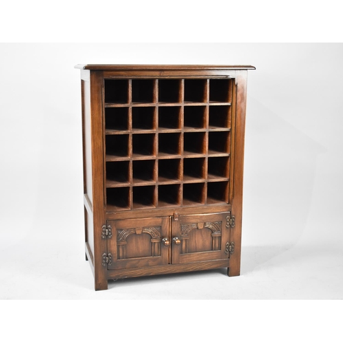 274 - A Mid 20th Century Bevan Funnel Oak Wine Rack with 25 Compartments and Base Cupboard with Carved Pan... 