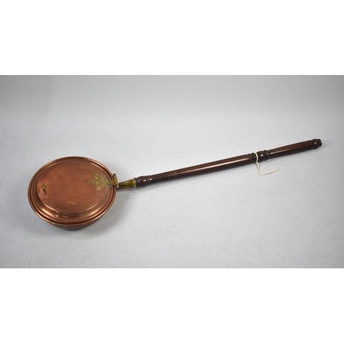 285 - A Copper and Brass Mounted Bed Warming Pan with Turned Wooden Handle