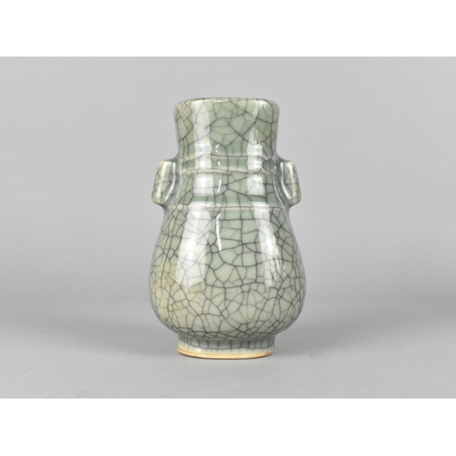 293 - A Chinese Celadon Crackle Glazed Arrow Vase, 13.5cm high