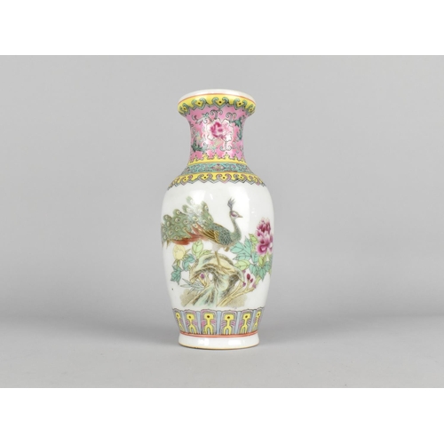 296 - A Chinese Porcelain Vase Decorated in the Famille Rose Palette with Peacock, 20.5cm high