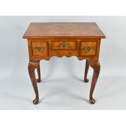 38 - A Reproduction Burr Walnut Lowboy with Small Centre Drawer Flanked by Two Deeper Drawers, Cabriole S... 