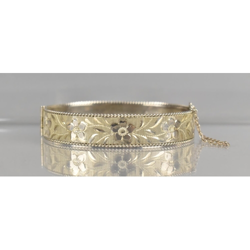 472 - A Vintage Silver Hinged Bangle having Textured Floral Decoration, Birmingham Hallmark for 1991 and M... 