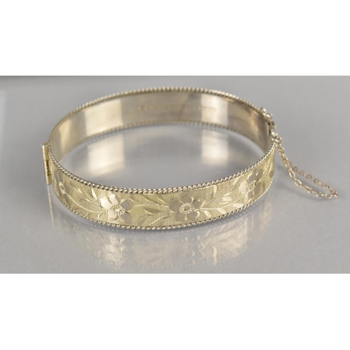 472 - A Vintage Silver Hinged Bangle having Textured Floral Decoration, Birmingham Hallmark for 1991 and M... 