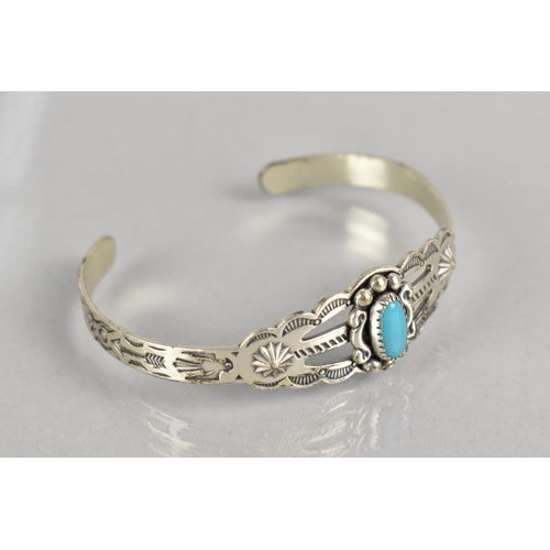 474 - A Small Childs Navajo Bangle with Turquoise Cabochon, Decorated with Thunderbirds, Arrows Etc and St... 