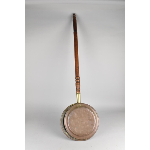 499 - A Copper Bed Warming Pan with Turned Wooden Handle