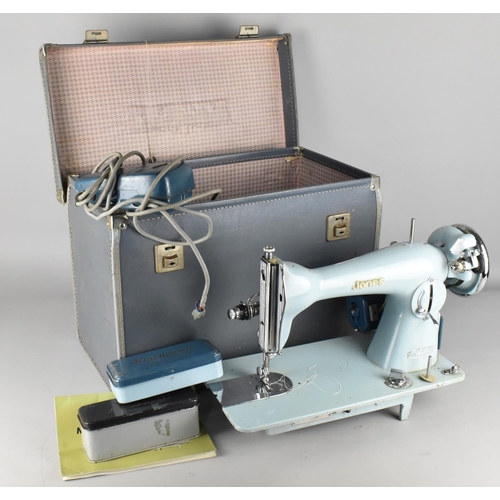 517 - A Cased Mid 20th Century Jones Electric Sewing Machine (Condition Issues)