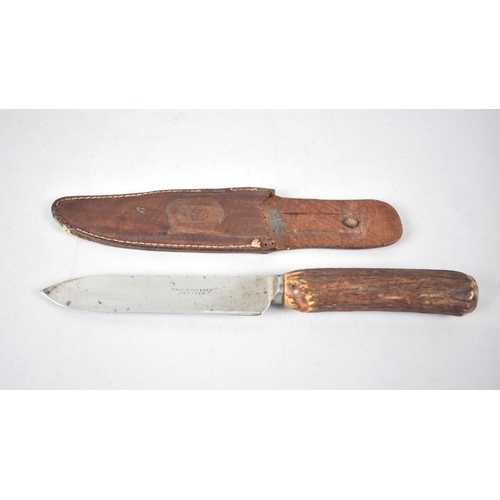 52 - A Vintage Hunting Knife in Leather Scabbard, Blade Inscribed Thomas Wood & Son, Chester, Bone Handle... 