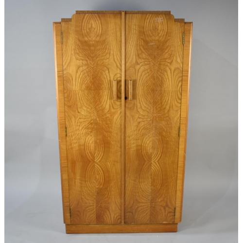 539 - An Art Deco Light Oak Shelved Linen Press with Burr Wood Veneer Doors, 84cms Wide