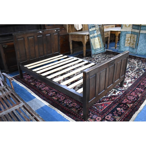 554 - An Oak Four Foot Bed Frame with Panelled Head and Footboard