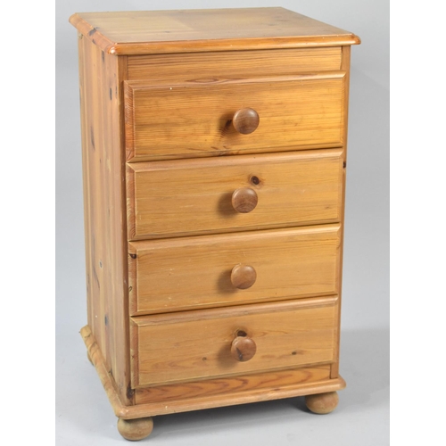 562 - A Modern Pine Four Drawer Bedside Chest, 44cms Wide