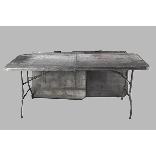 563 - A Set of Three Folding Metal Framed Trestle Tables