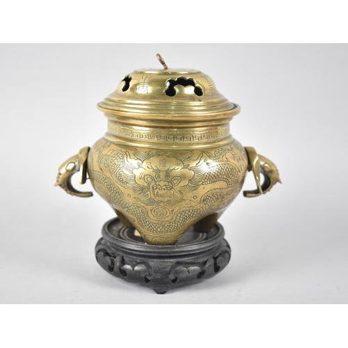 58 - A Chinese Bronze Globular Lidded Censer with Elephant Head Handles and Engraved Body on Unrelated Pi... 