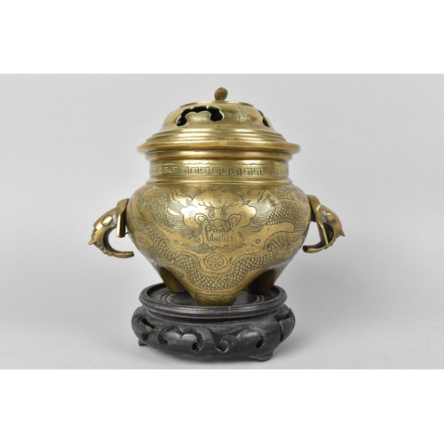 58 - A Chinese Bronze Globular Lidded Censer with Elephant Head Handles and Engraved Body on Unrelated Pi... 