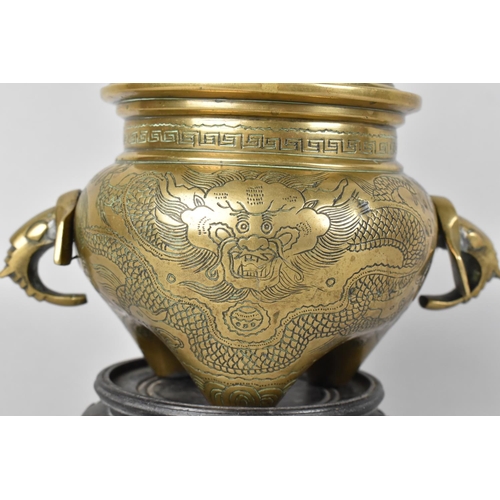 58 - A Chinese Bronze Globular Lidded Censer with Elephant Head Handles and Engraved Body on Unrelated Pi... 