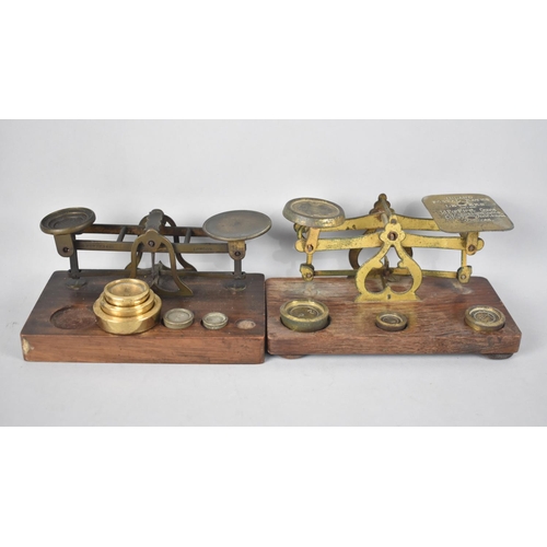 64 - Two Early 20th Century Brass Postage Scales and Weights on Wooden Plinth