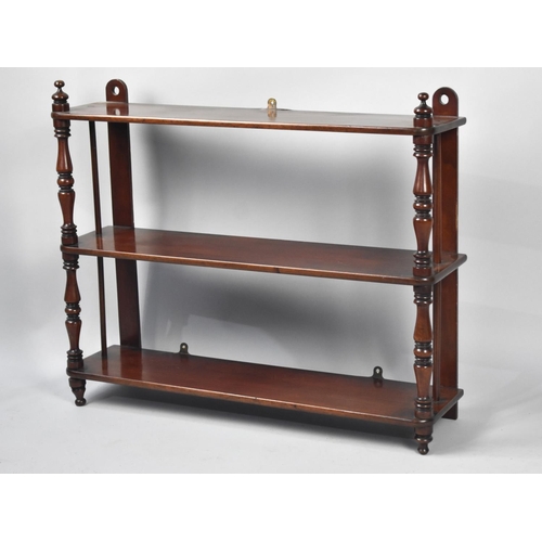 65 - An Edwardian Wall Hanging Unit with Turned Supports, 69cms Wide