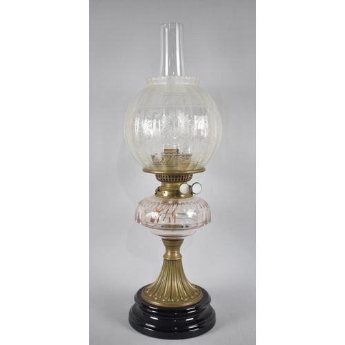 71 - A Late Victorian Brass Based Oil Lamp with Plain Glass Reservoir and Etched Shade, Complete with Chi... 