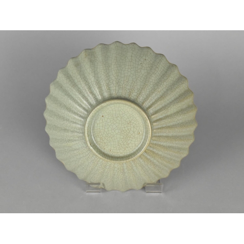 453 - A Chinese Celadon Bowl of Reeded Form, 18cm Diameter