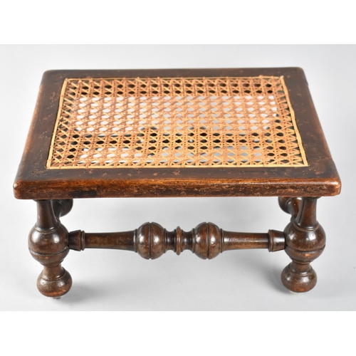 12 - An Early 20th Century Cane Topped Rectangular Stool with Turned Supports and Stretchers , 34cm X 27c... 