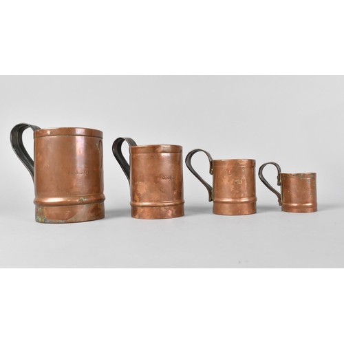 124 - A Set of Four Graduated Copper Measures , One for Mason's Arms and Three for The Cock Inn