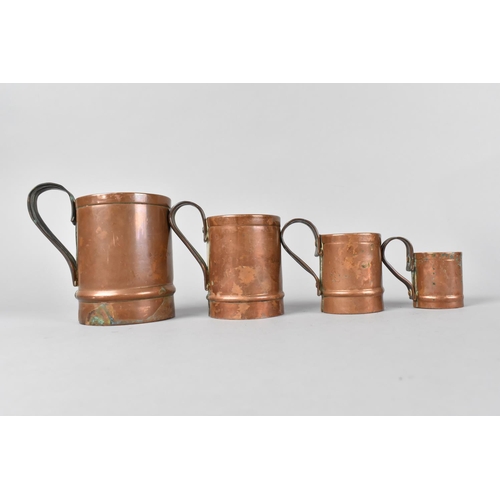 124 - A Set of Four Graduated Copper Measures , One for Mason's Arms and Three for The Cock Inn