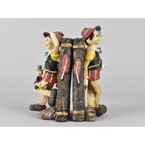 134 - A Pair of Novelty Resin Bookends in the Form of Pinocchio , 13cm High