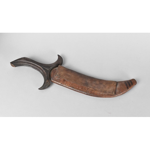 144 - A Far Eastern Curved Bladed Kris Type Dagger with Leather Scabbard , 30cm Long