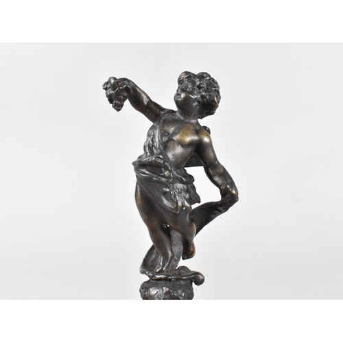 19 - A Patinated Bronze Novelty Corkscrew, the Handle in the Form of a Cherub Carrying a Bunch of Grapes,... 