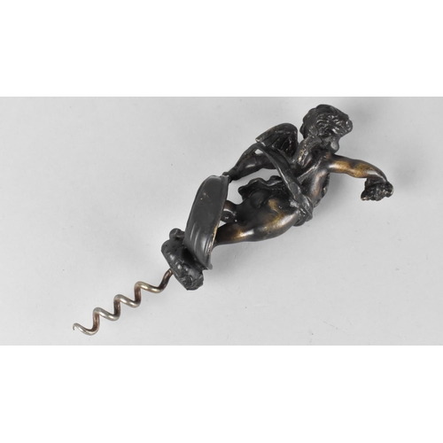 19 - A Patinated Bronze Novelty Corkscrew, the Handle in the Form of a Cherub Carrying a Bunch of Grapes,... 