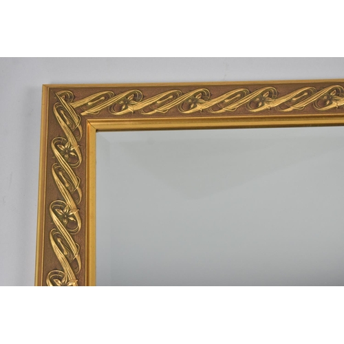 237 - A Gilt Framed Rectangular Wall Mirror with Whiplash Stylised Border, 95x65cm Overall