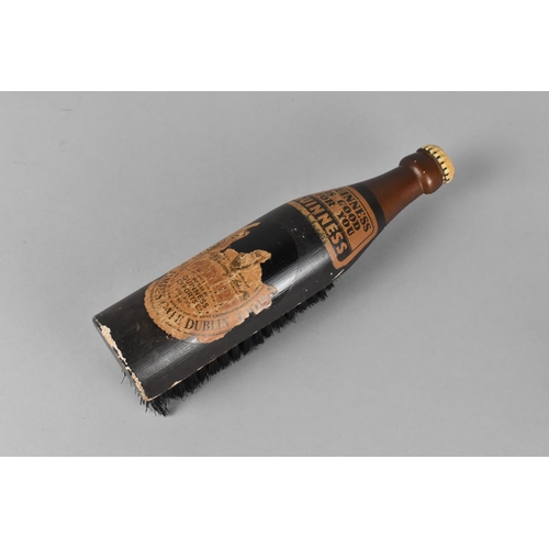 46 - A Novelty Clothes Brush in the Form of a Bottle of Guinness Stout, 21.5cm