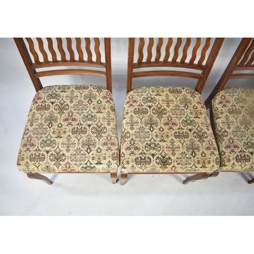 554 - A Set of Four Edwardian Mahogany Framed Dining Chairs with tapestry Upholstery