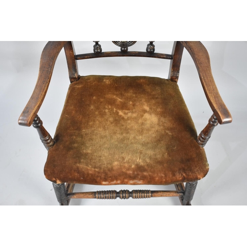 558 - A Late Victorian/Edwardian Rocking Armchair with Velvet Upholstered Seat