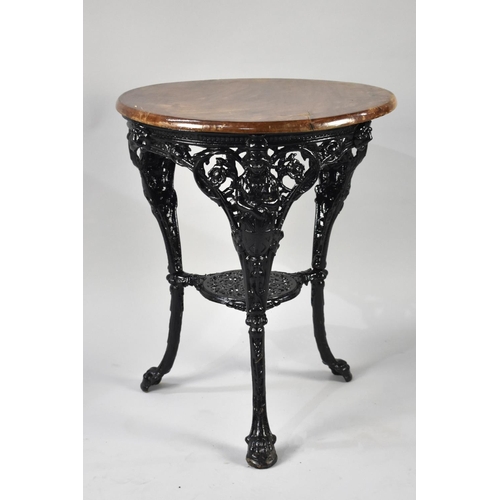 559 - A Cast Metal Black Painted Britannia Pub Table with Wooden Top, 62cm Diameter Top