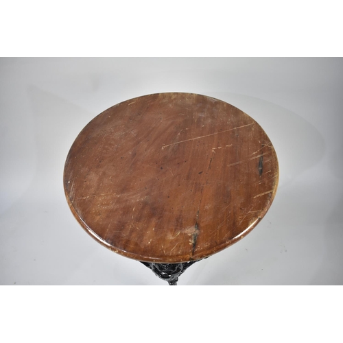 559 - A Cast Metal Black Painted Britannia Pub Table with Wooden Top, 62cm Diameter Top