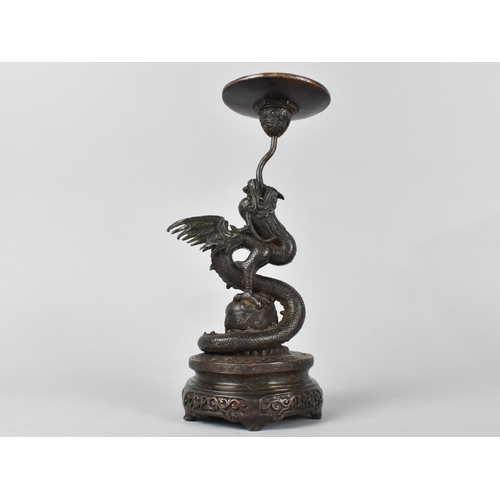 69 - A Patinated Bronze Candle Pricket Modelled as a Dragon, Circle Base, 24cm High